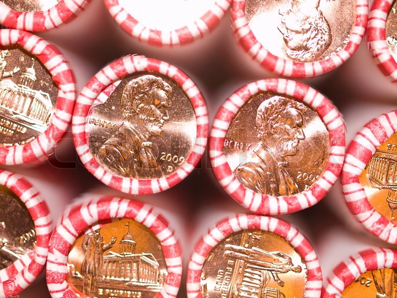 penny-rolls-lined-up-in-a-box-of-coins-stock-image-colourbox