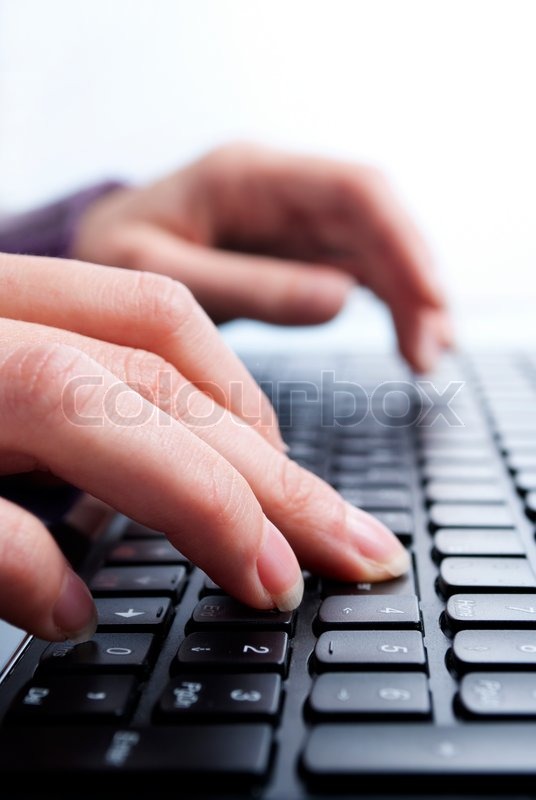 Writing on laptop Stock image Colourbox