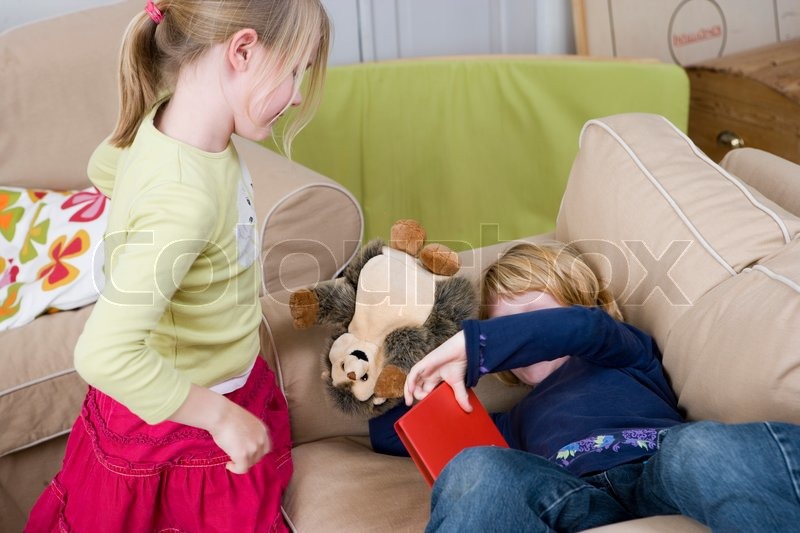 Two young girls playing in the living ... | Stock image | Colourbox