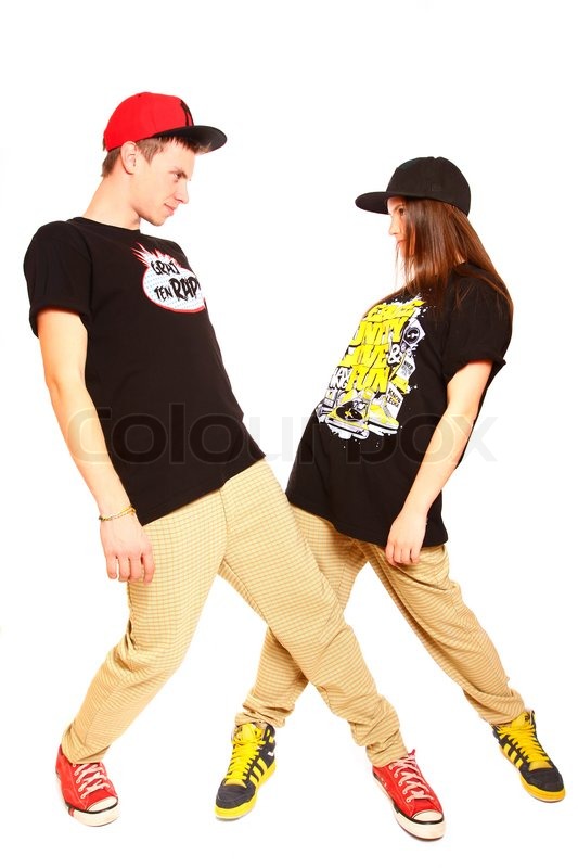 couple of young man and woman dancing hip hop at studio stock