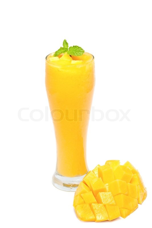 Fresh mango juice in a glass over white background | Stock image | Colourbox