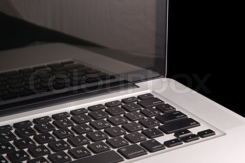 Aluminium laptop with desktop on black Stock image Colourbox