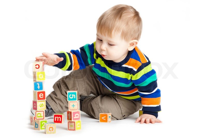 Baby playing with wooden toy cubes with letters Wooden 