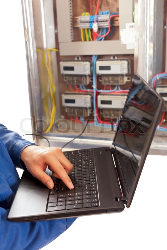 Electrician working with laptop at the ... | Stock image | Colourbox