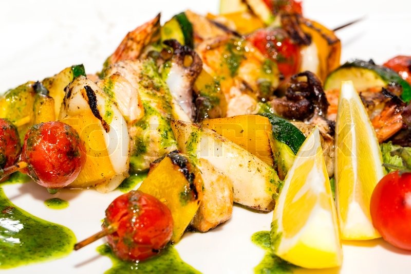 Skewers of seafood grilling Stock image Colourbox