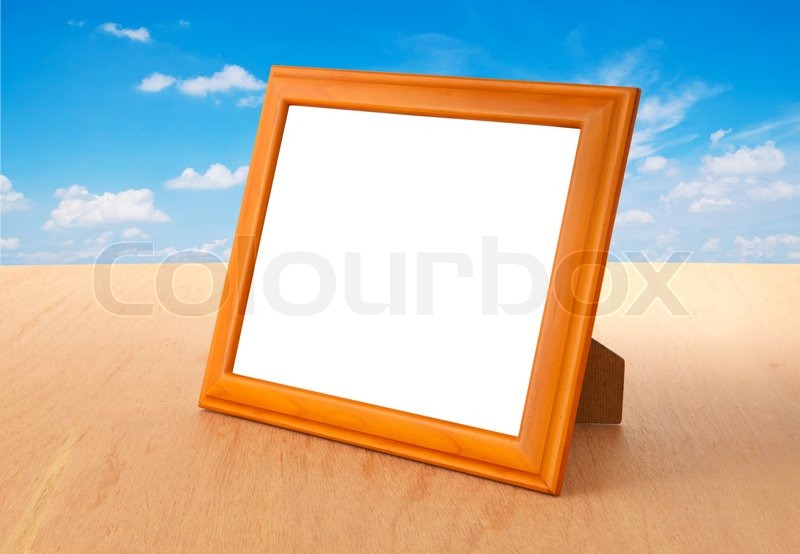 Photo frames on the table Stock Photo Colourbox