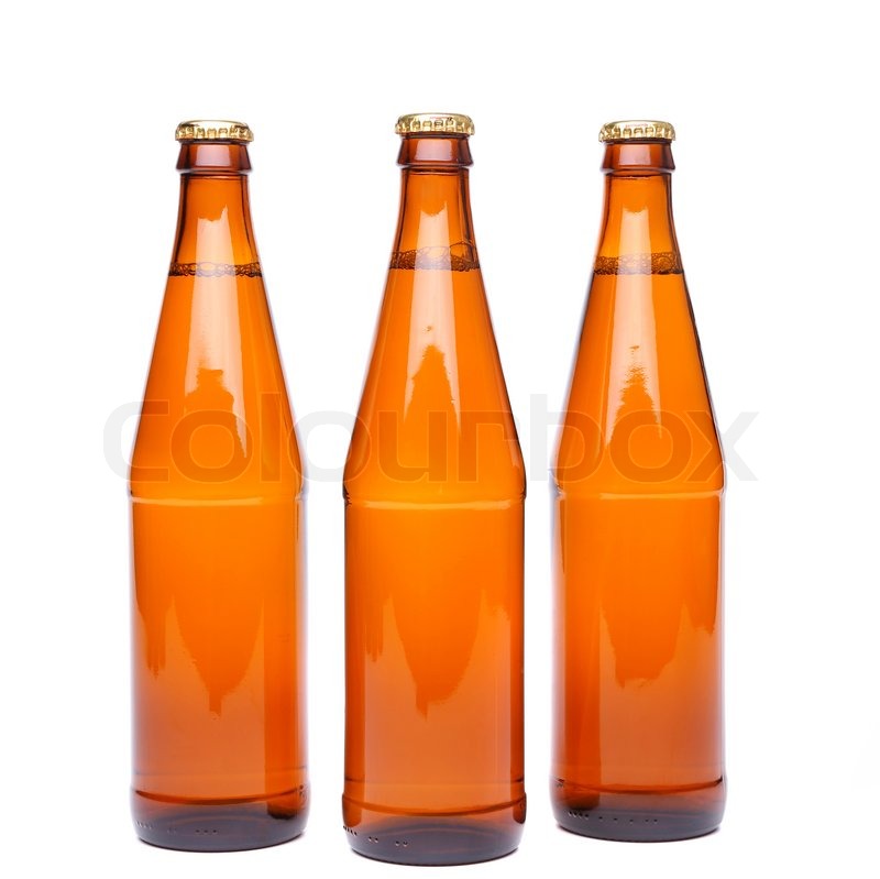 Three brown beer bottle with drops Stock image Colourbox