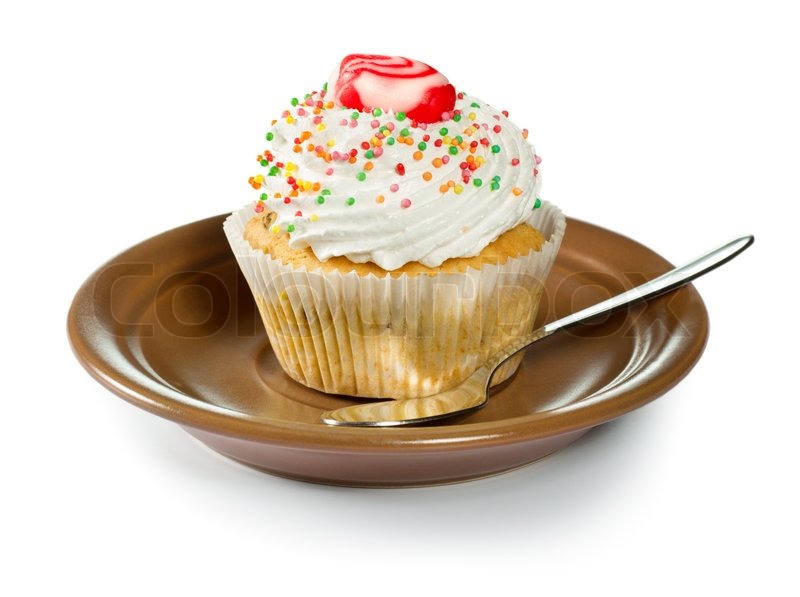 Cupcake on brown plate isolated on | Stock image | Colourbox
