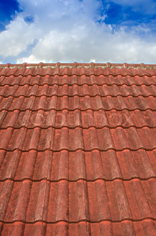 The Tiled Roof with Fluffy Cloud Blue Stock image Colourbox