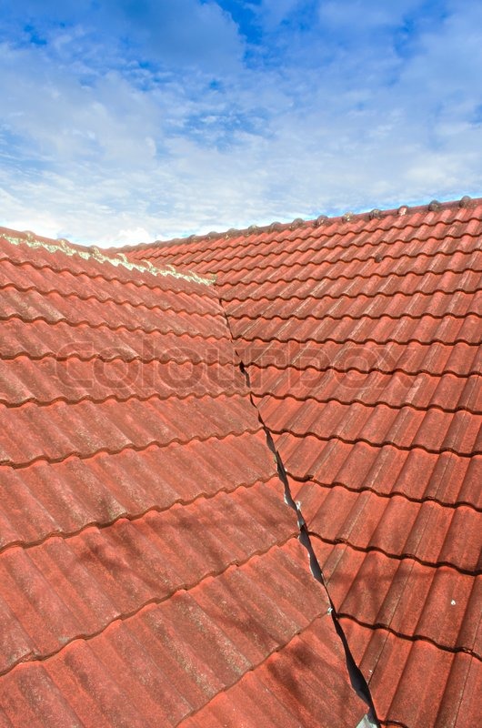 The Tiled Roof with Fluffy Cloud Blue Stock image Colourbox