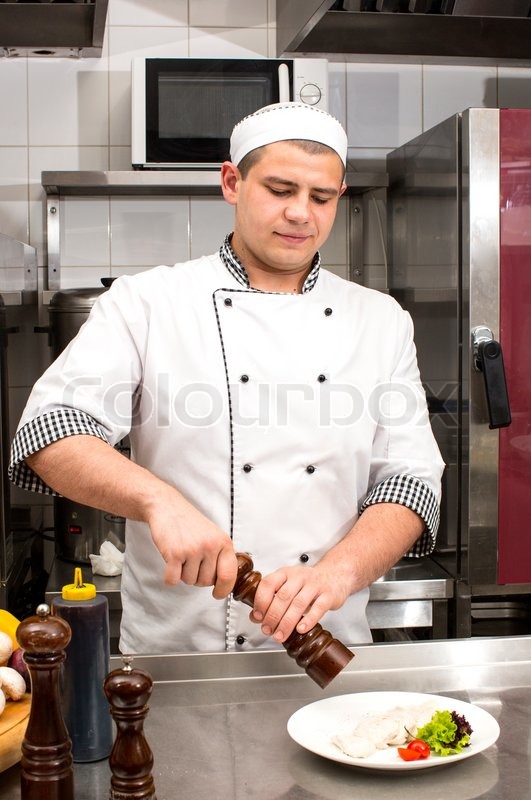 Chef preparing food in the kitchen at | Stock image | Colourbox
