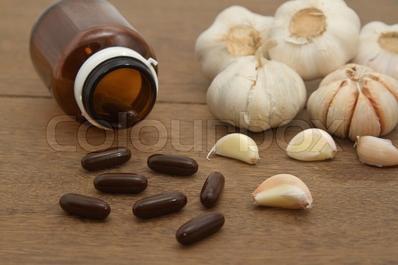 Garlic herbal supplement pills , Stock image Colourbox