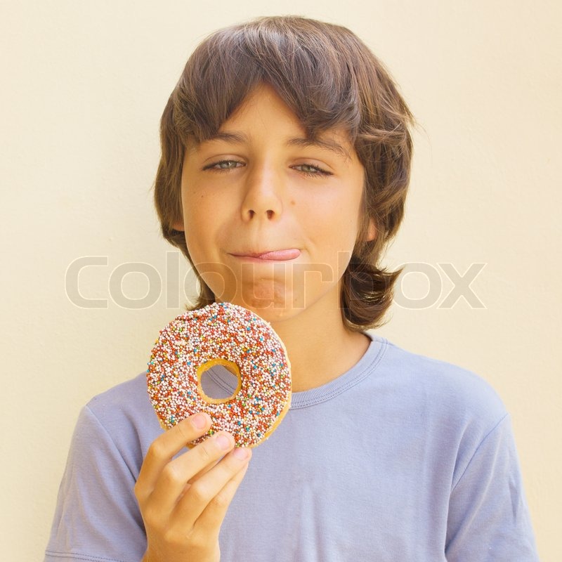 Teen Caicasian Boy Licking His Lips At Stock Image Colourbox