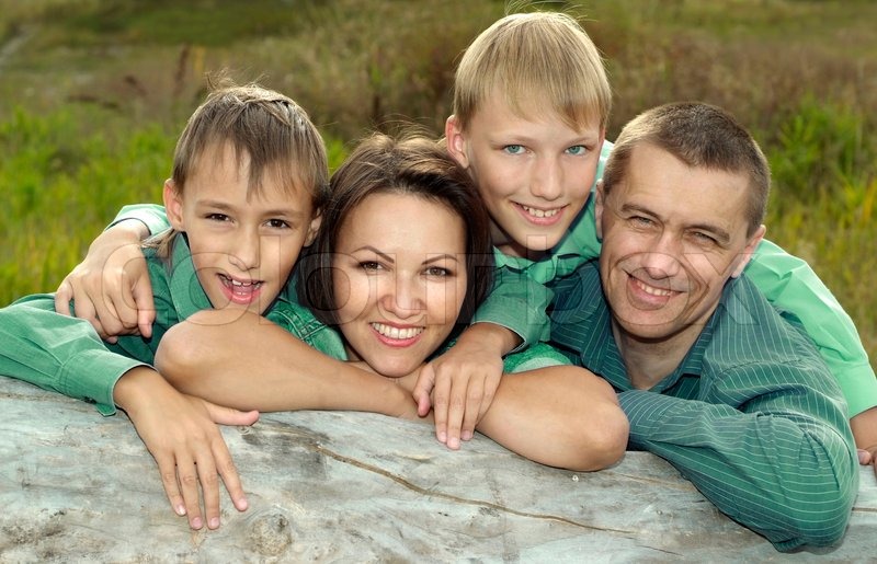 Family of a four playing at nature | Stock image | Colourbox