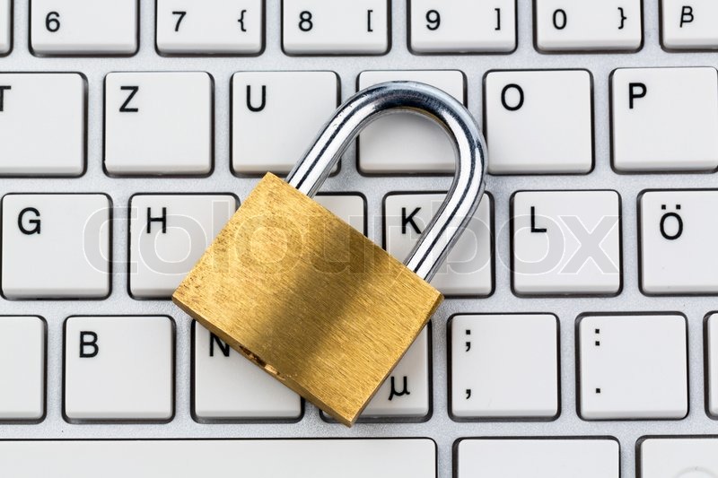 A padlock on a computer keyboard. Stock image Colourbox