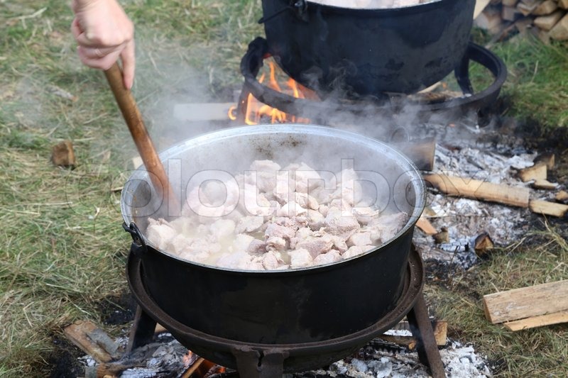 Cooking process in a cauldron. Whole Stock image Colourbox