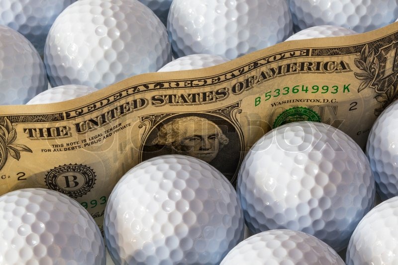 Dollars banknotes and white golf balls Stock image Colourbox