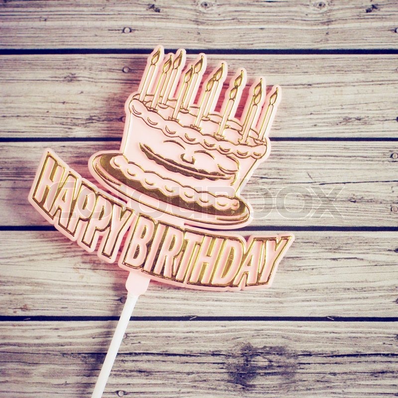 Happy birthday on wooden background with retro filter effect | Stock