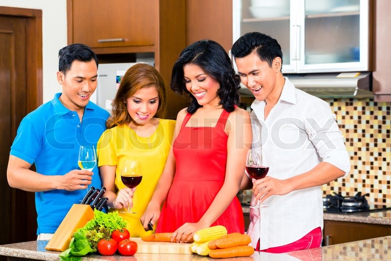Asian Friends Cutting Vegetables Stock Image Colourbox