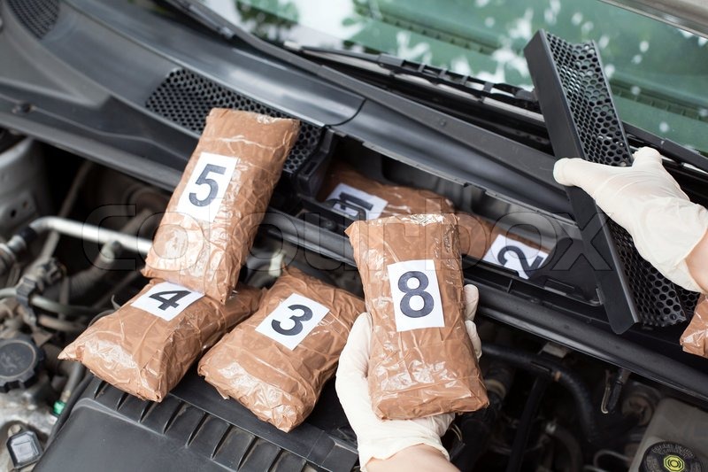 Hidden drugs in a vehicle compartment Stock Photo