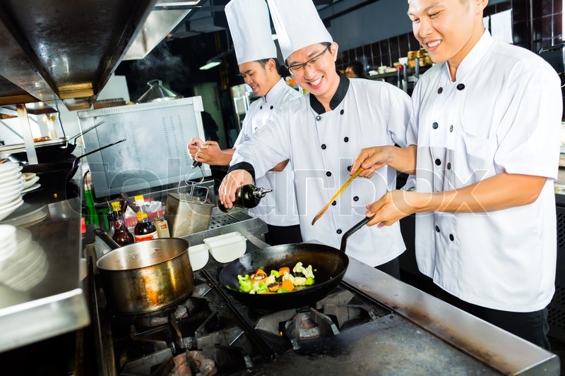 Chef Cooking Chef Restaurant kitchen Asian Cook Stock image 