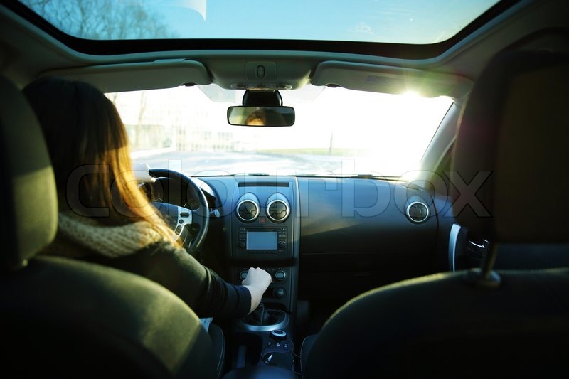 Young woman driving a car. View from ... | Stock image | Colourbox