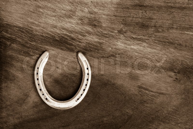 Horseshoe on wooden floor | Stock image | Colourbox