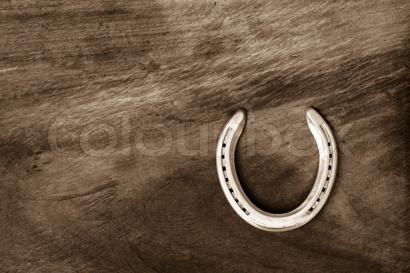 Horseshoe on wooden floor | Stock image | Colourbox