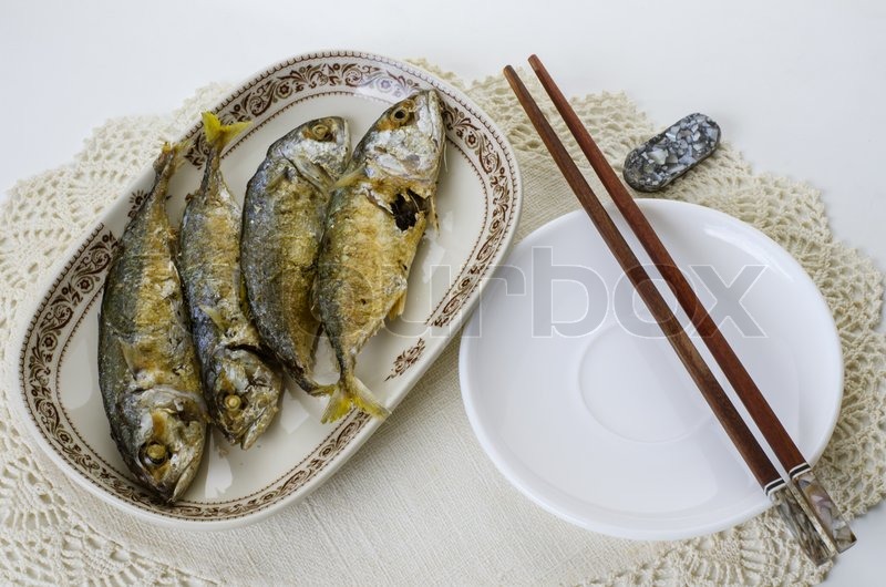 Fried indian mackerel in ceramic dish Stock image Colourbox