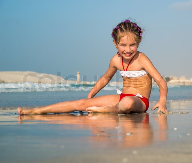 Young Girl On The Beach