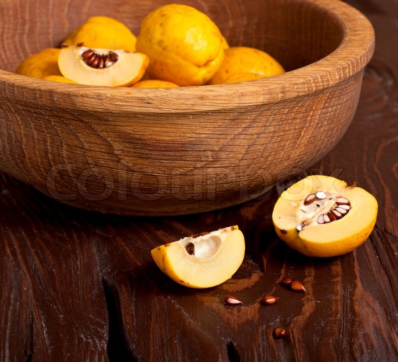 Apple quince on wooden table | Stock image | Colourbox