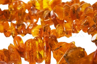 Zwei gelbe Federn auf grauem Stein Hintergrund im Hochformat | Stock